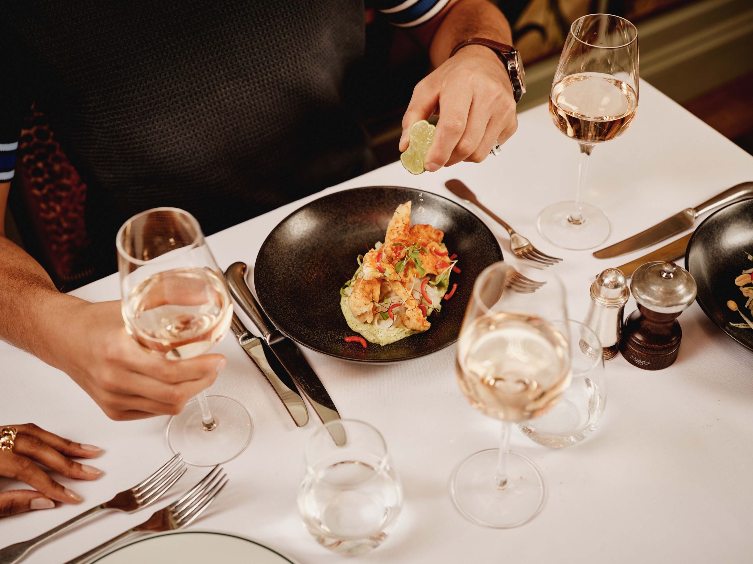 Guests having dinner at The Ivy In The Lanes, Brighton.