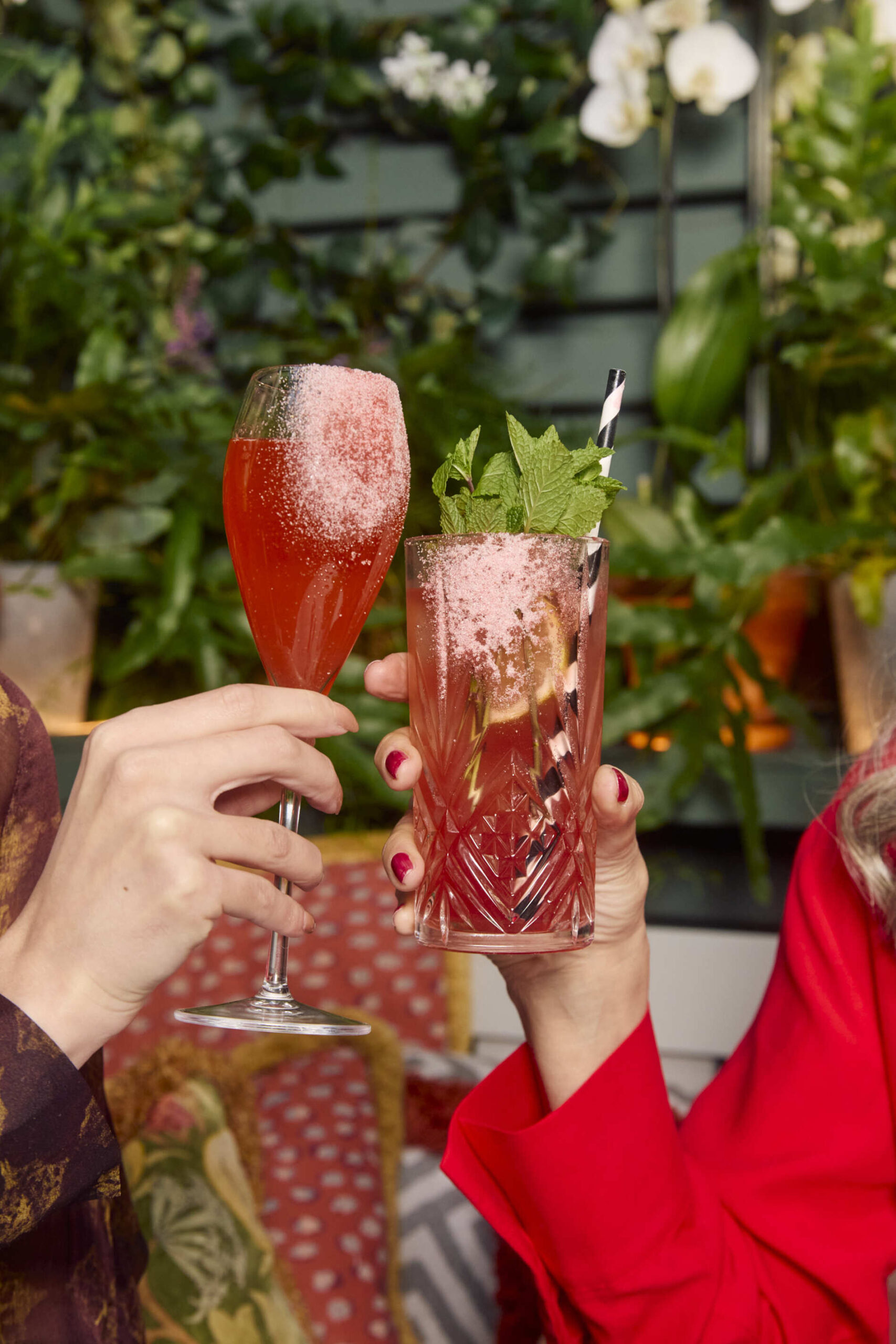 Guests cheersing with cocktails at The Ivy.