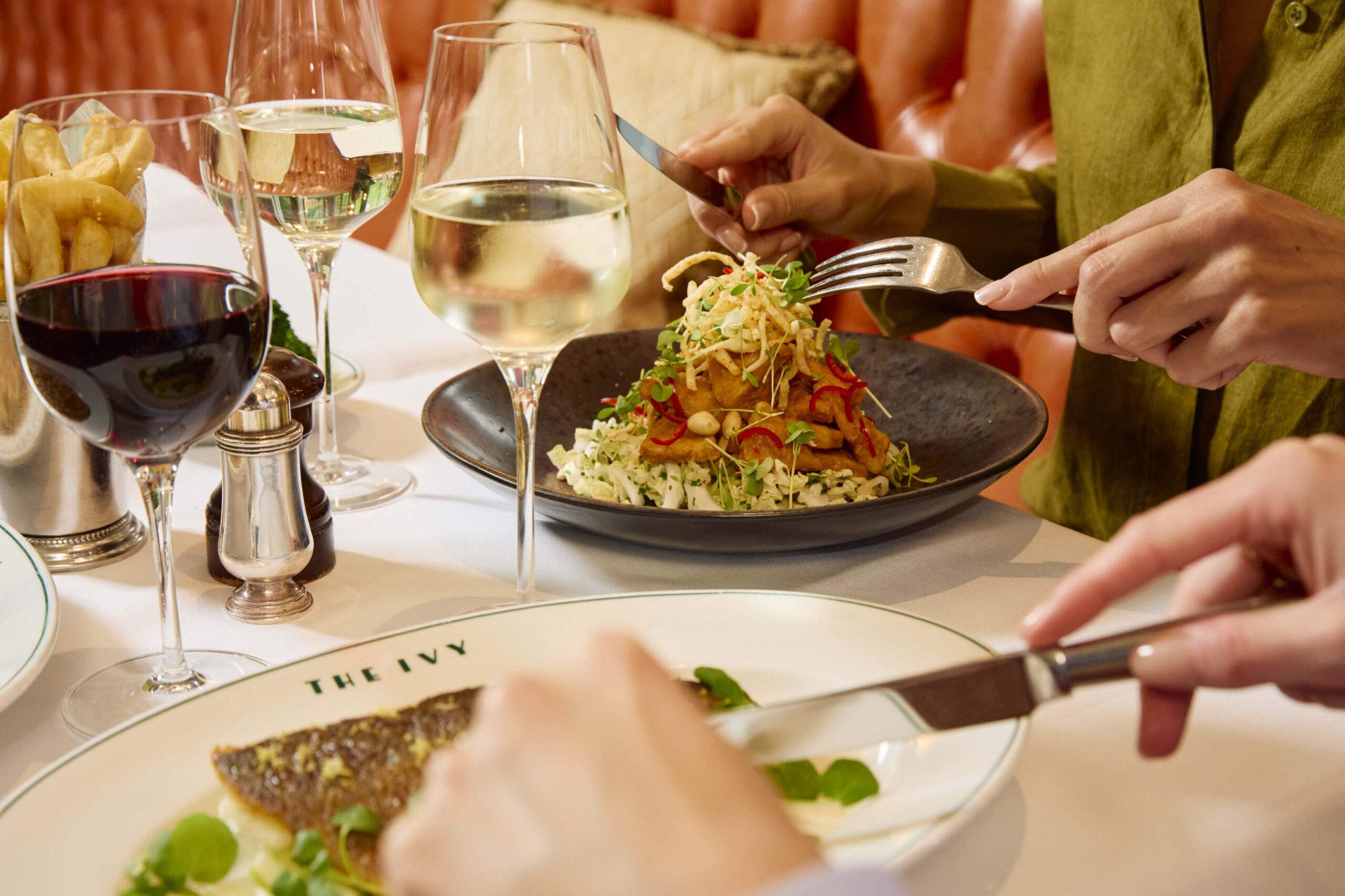 guests enjoying food at the ivy canary wharf butterfly room