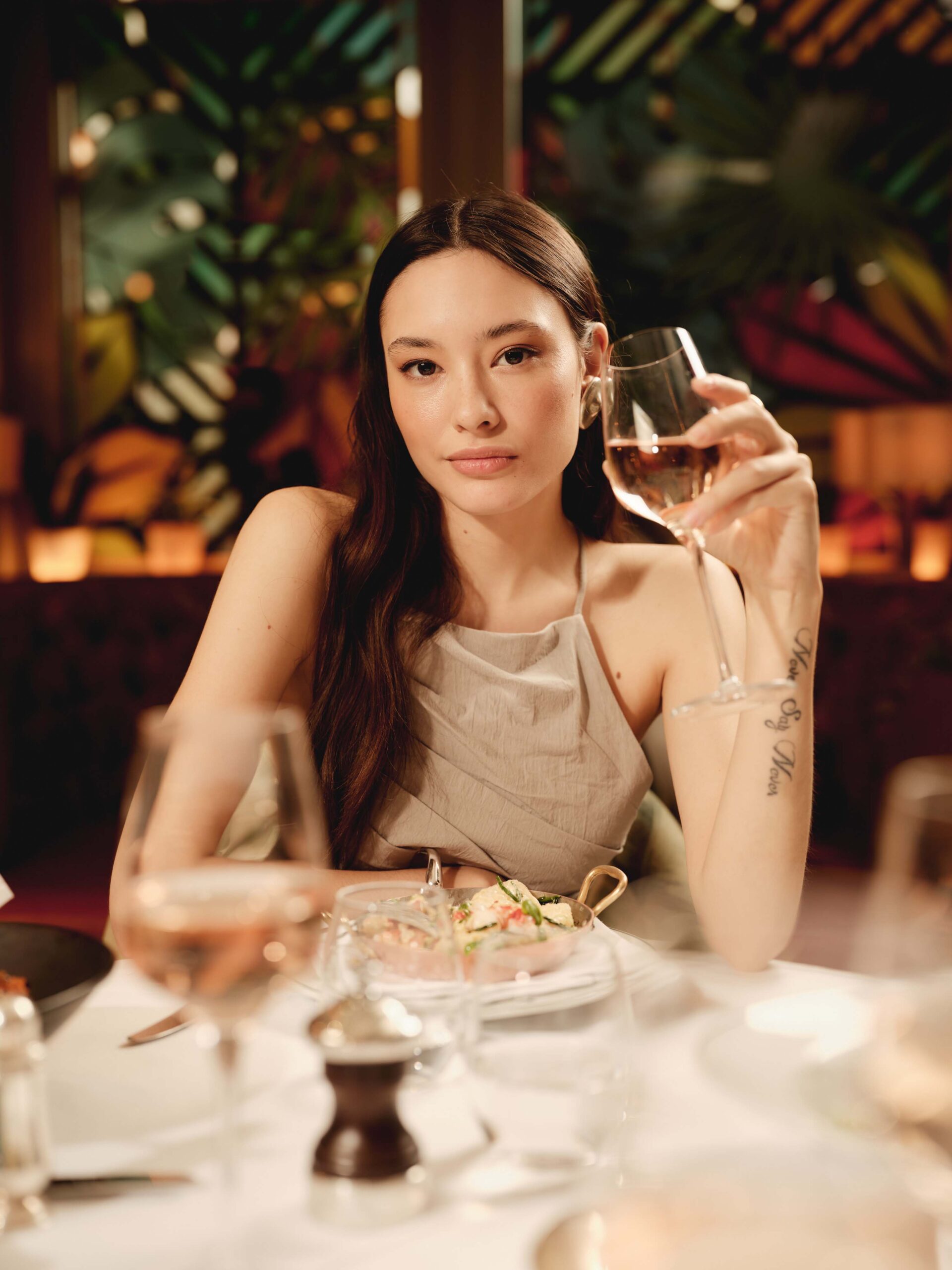 guest enjoying drink at a private dining event in cheltenham