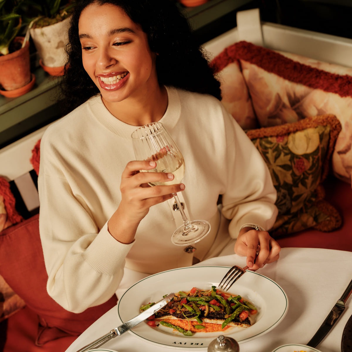 Guest enjoying her dinner at The Ivy.