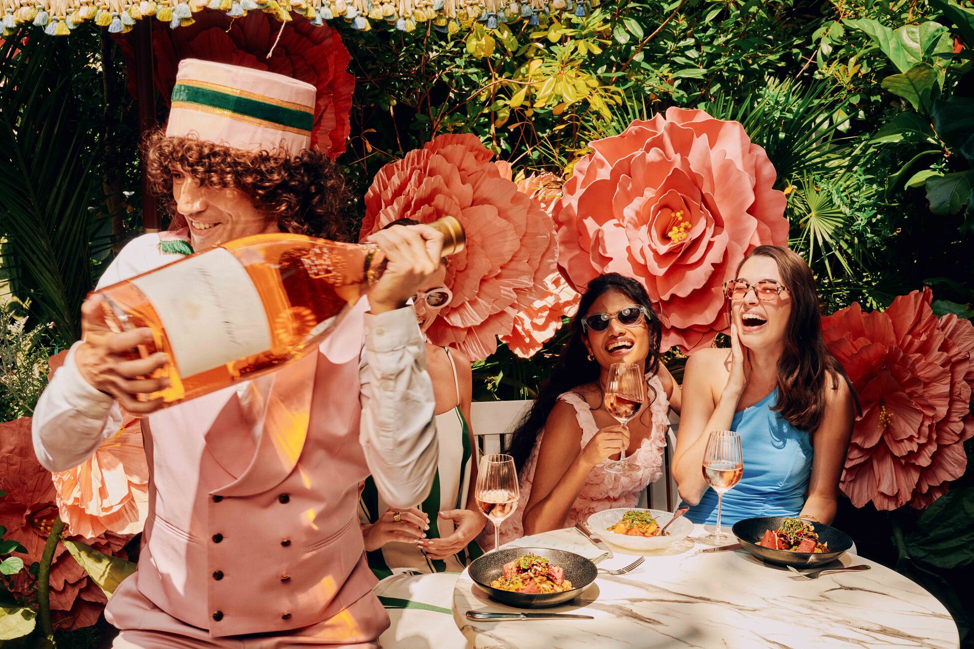 waiter pouring rose at the ivy