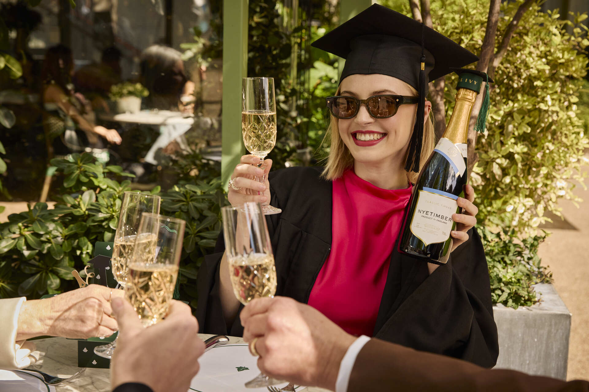 student celebrating graduation at the ivy
