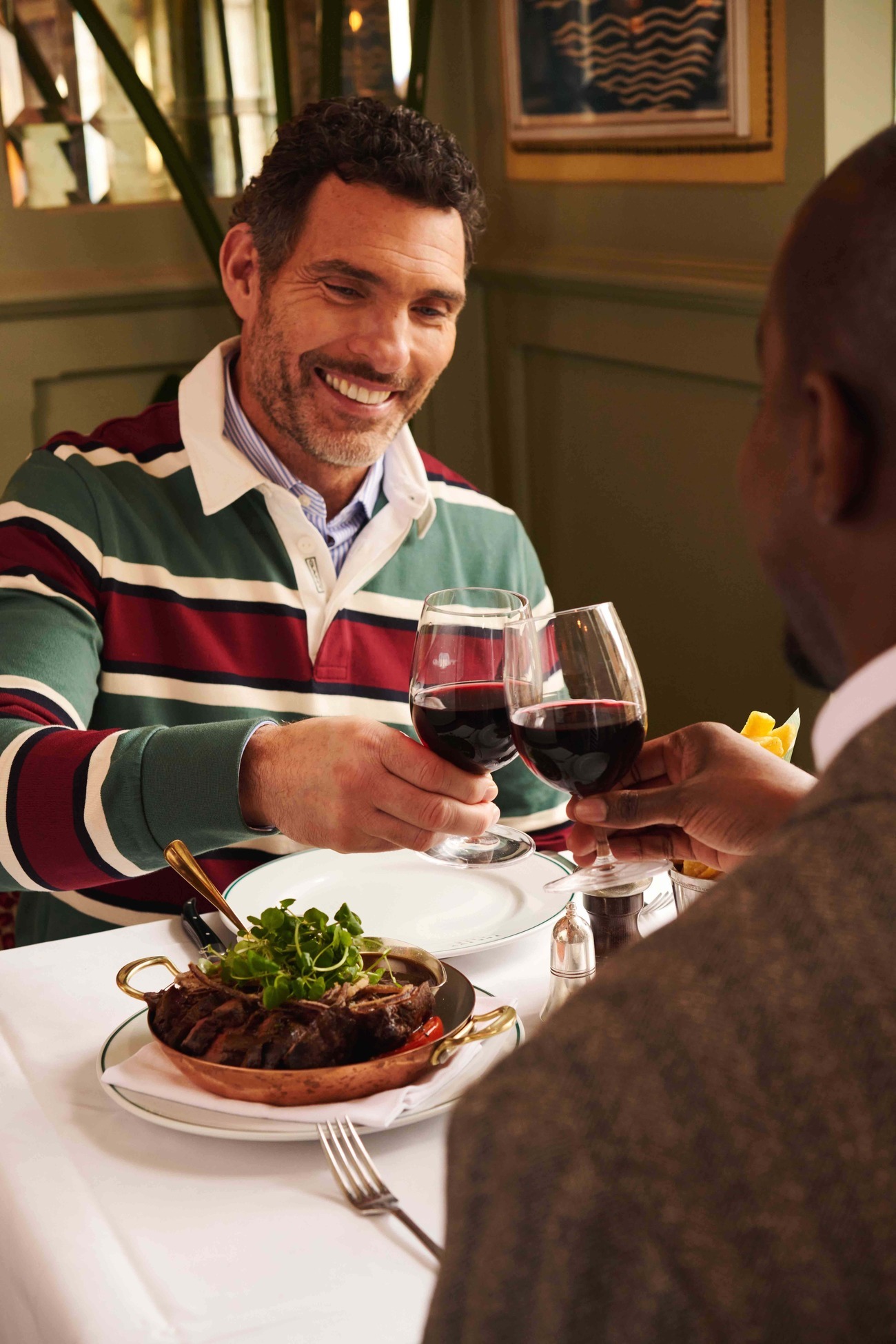 man drinking at The Ivy