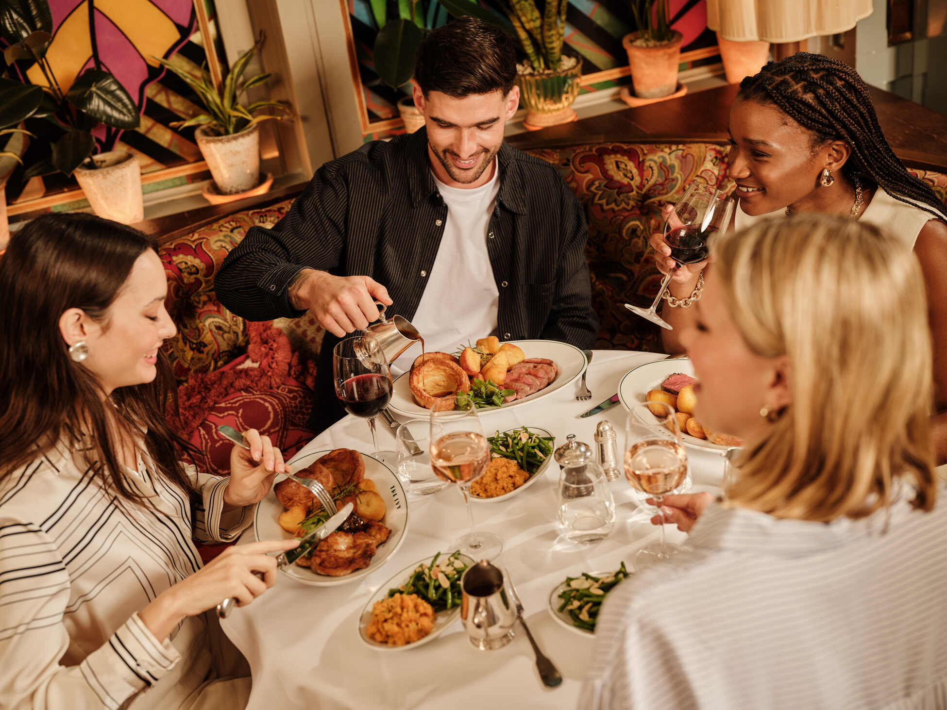 guests enjoying a Sunday roast at the ivy