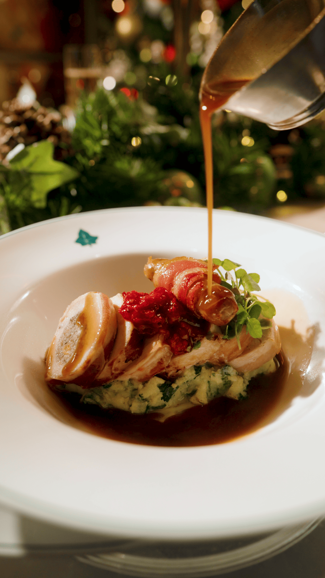 saucing being poured over a dish at the ivy